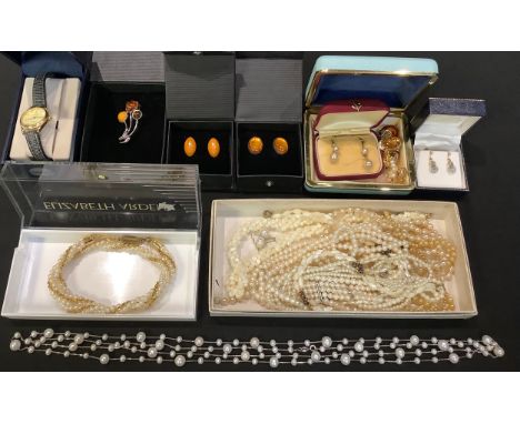A pair of 9ct gold droplet screw fasten earrings, 2g, boxed; a pair of Baltic amber silver mounted clip earrings, marked 925;