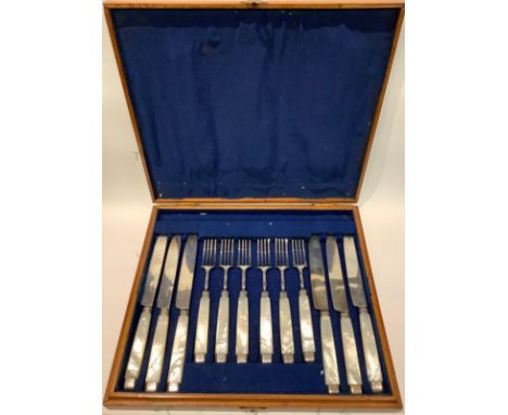 A set of six Georgian silver and mother of pearl hafted knives and forks, later fitted case, 421g gross 