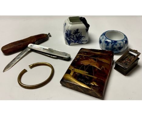 A silver and mother of pearl fruit knife, Sheffield 1930, soft leather pouch ; a hand painted tortoise shell card case, paint