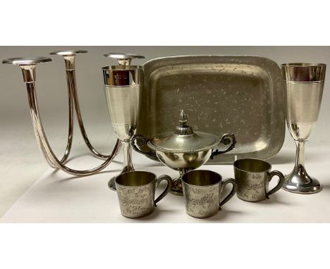 A Norwegian Skurdal pewter tray with three cups; a 20th century three branch table candlestick, 19cm; a pair of silver plated