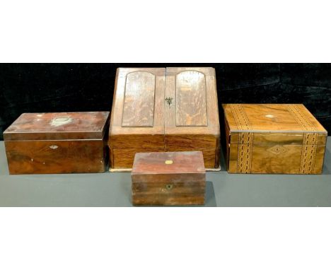 Boxes - a Victorian oak slope front stationery box; a Victorian work box; a George III mahogany tea caddy; another (4) 