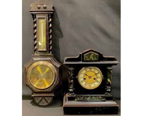 A late 19th century ebonised mantel clock, c.1870-1880; an oak wall mounted combination barometer (2) 