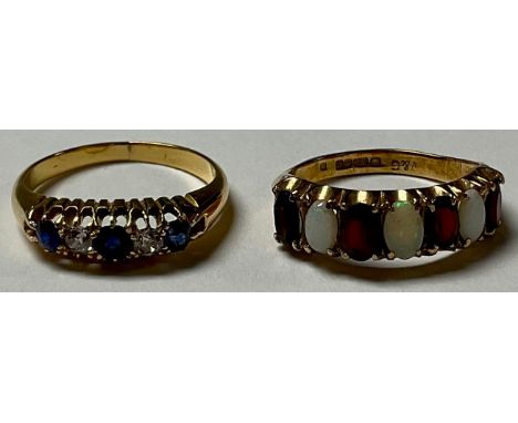A 14ct gold diamond and sapphire ring, size L, 3.2g; a 9ct gold garnet and opal ring, size K/L, 2.5g (2) 