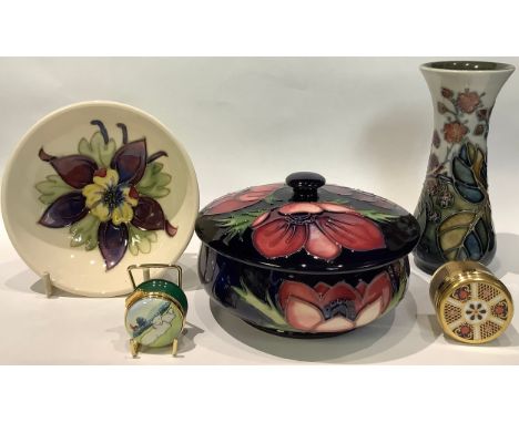 A Moorcroft Anemone pattern powder jar and cover; a Moorcroft Hedgerow Berries pattern vase; a Moorcroft dish; a Moorcroft en