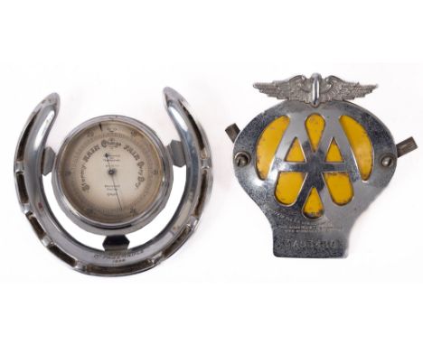 A silver plated horseshoe mounted Aneroid barometer, the silvered vernier dial numbered K.65737 and retailers mark for 'Brufo
