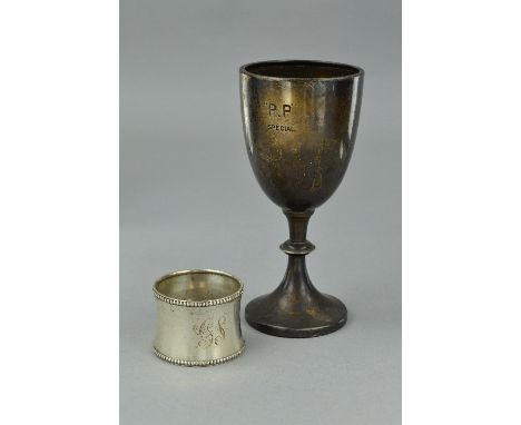 A SILVER CUP AND NAPKIN RING, approximate weight 85.6 grams