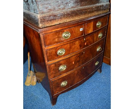 A GEORGIAN WALNUT BOWFRONT CHEST, of two short and three long graduated drawers on outsplayed bracket feet, approximate size 