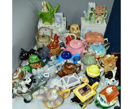 TWENTY FOUR VARIOUS TEAPOTS, to include limited edition Disney 'Aviator Mickey' No1043/5000, boxed Enesco Beatrix Potter teap