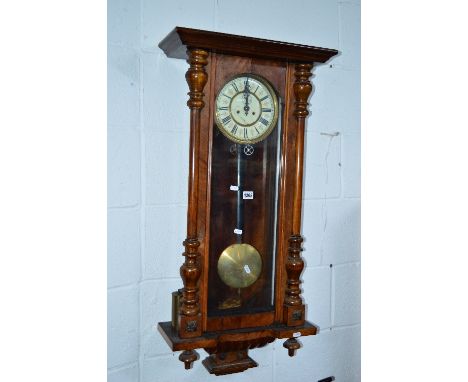 A VICTORIAN WALNUT VIENNA WALL CLOCK, circular enamel dial with Roman numerals (two weights and pendulum) (sd)