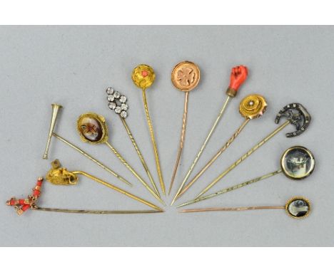 A 9CT PARCEL OF TWELVE MIXED STICK PINS, a 9ct yellow metal, enamel, fox's head, horses's head, etc