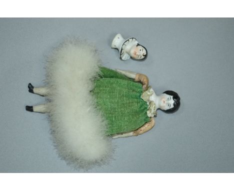 A CERAMIC HEAD DOLL, unmarked ceramic head and shoulders, cloth body with cloth and ceramic arms and legs, some minor wear, s