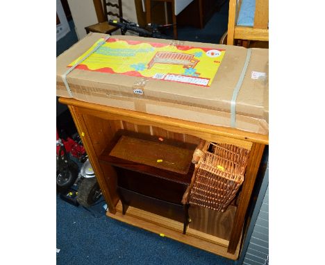 A BOXED PINE BENCH, a pine bookcase, a pine toy box, a magazine rack, basket and an occasional table (6)