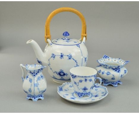 A ROYAL COPENHAGEN TEAPOT No.140, a cup and saucer, a cream jug No.392 and sugar bowl No 153