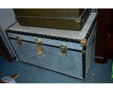 A MODERN TRUNK, with metallic covering