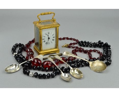 A MINIATURE CARRIAGE CLOCK, beads, three silver spoons and others