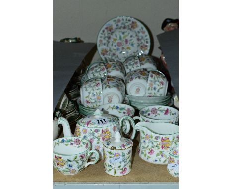 MINTON 'HADDON HALL' PATTERN TEA WARES, to include sixteen cups, nineteen saucers, four bowls, teapot, milk jug and two musta