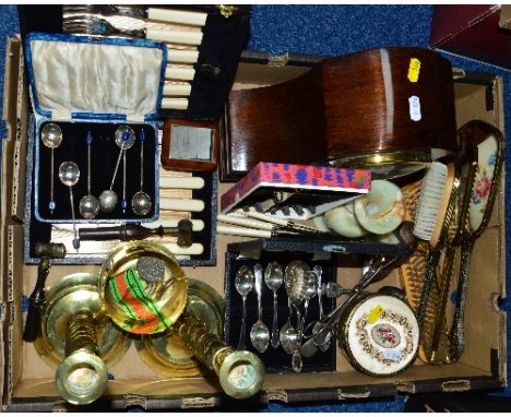 A BOX OF SUNDRIES, to include powder measures, cutlery, mantel clock, brass candlesticks, petit point brush set, WWII 1939 - 