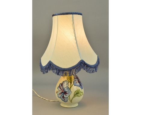 A MOORCROFT POTTERY LAMP BASE, 'Hibiscus' pattern on cream ground, impressed marks to base, approximate height 20cm (not incl