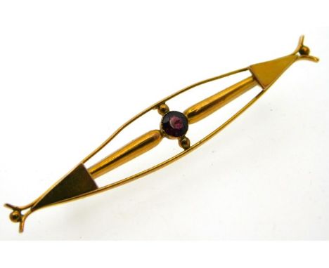 A 9ct gold bar brooch set with garnet, 2.5g, 60mm wide