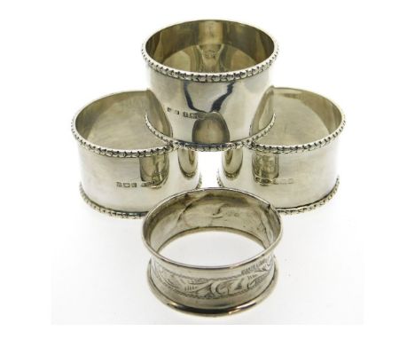 Three 1920 Birmingham silver napkin rings with one other 1920 napkin ring, 100.7g