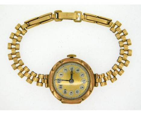 A ladies 9ct gold cased watch with rolled gold strap, 18.2g inclusive 