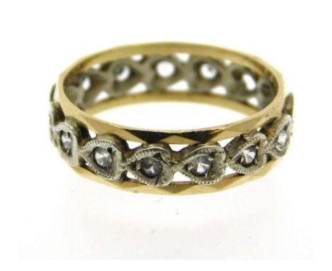 A 9ct two colour gold eternity ring lacking two stones, 2.5g, size N/O