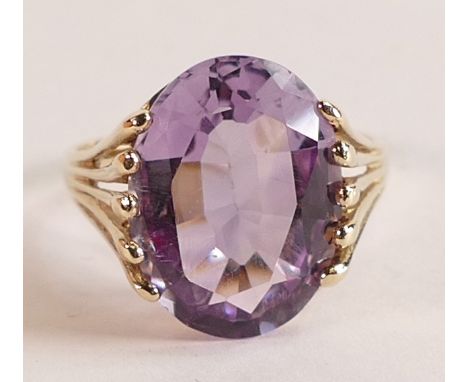 9ct gold ladies dress ring set with large purple oval stone, size N, 3.5g. 