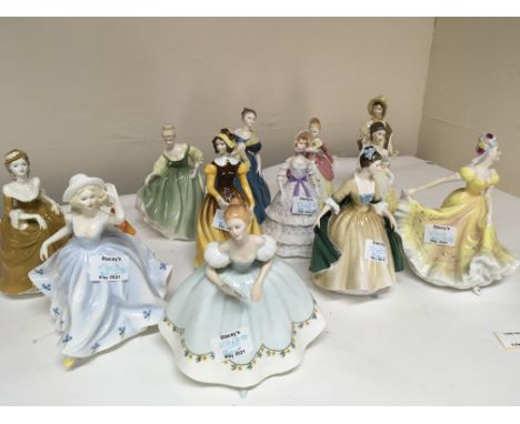 A collection of thirteen Royal Doulton and Worcester figures (13)