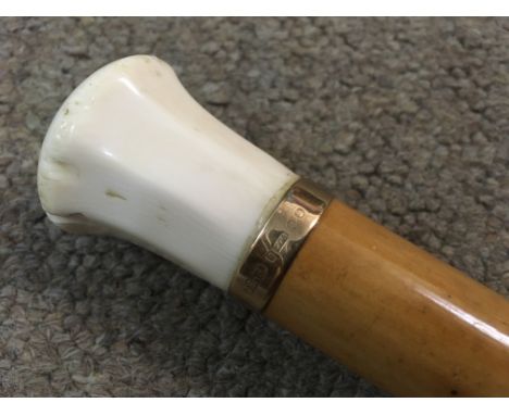 An Ivory topped walking stick with 9ct gold ring