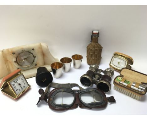 A collection of oddments, including : vintage motorcycle goggles, stirrup cups in a leather case, a glass flask, a 1930s Art 