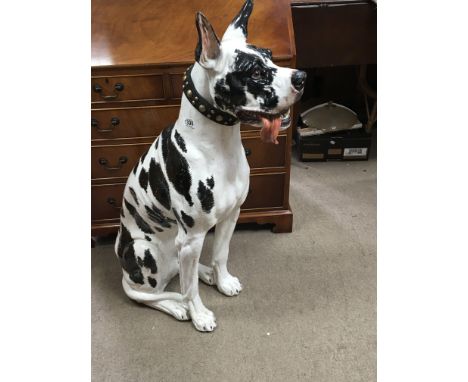 A large life size ceramic model of a dog. Height 104cm