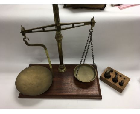 A set brass beam balance scales. Approximately 60cm in height.