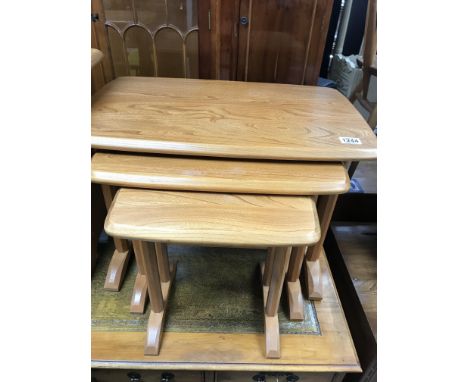 A nest of three Ercol tables.