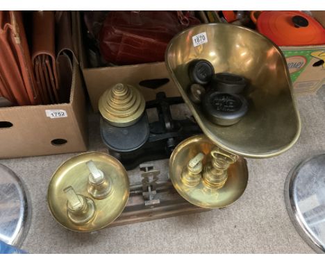 A large set of brass and cast iron Avery scales plus a similar pair of French balance scales.