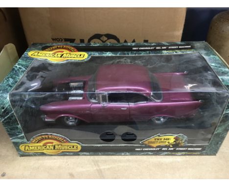 A boxed American Muscle 1957 Chevrolet Bel Air die cast model car.