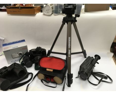 A collection of cameras, a tripod, a video camera and two pairs of binoculars. All with Cases.