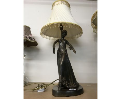 A lamp in the form of a Art Deco style bronzed figure, together with shade. Height 44cm approx