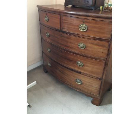 A Victorian mahogany bow fronted chest of drawers fitted with two short and two long drawers on bracket feet.
