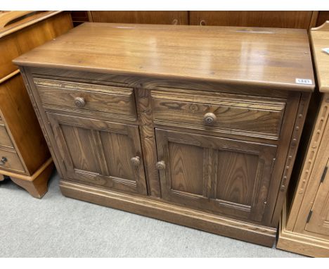 A small Ercol dark oak 2 draw, 2 door buffet sideboard. 98 x 49 x 71cm.