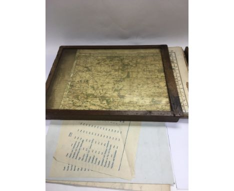 A collection of WW2 era Ordnance Survey maps in a case.