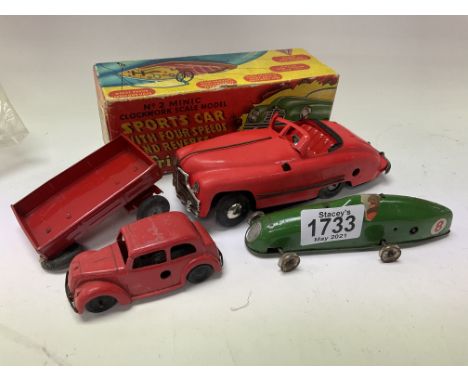 A boxed Triang Minic clockwork sports car, Triang green racing car plus an additional Triang car.