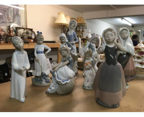 Seven Lladro figures and two NAO figures