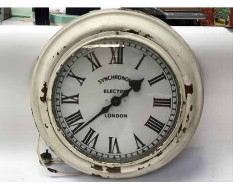 A 1940's synchro wall clock with an enamel dial. Removed from the Bryant and May factory in Bow circa 1978. Measuring approxi