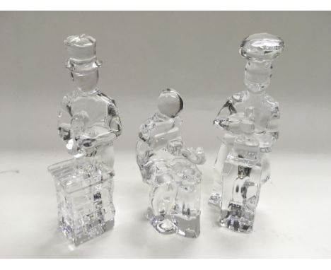 Three Orrefors glass figures comprising a baker, cobbler and a chimney sweep. Tallest measures approx 14.5cm.