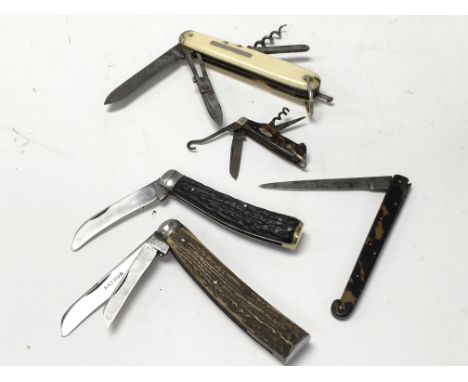 A collection of pocket tools including: A rare 19th century ivory handled multi tool Pocket knife, 2 stag handled pocket kniv