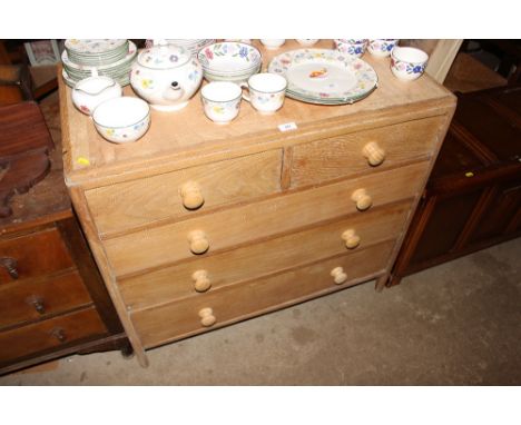 A light oak chest fitted two short over three long drawers 