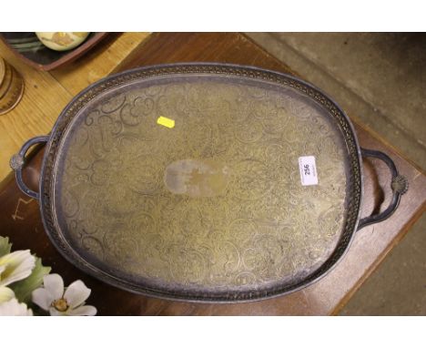 A silver plate and foliate engraved drinks tray