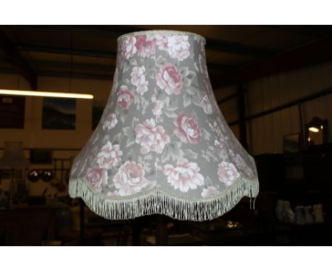 A mahogany standard lamp and shade 