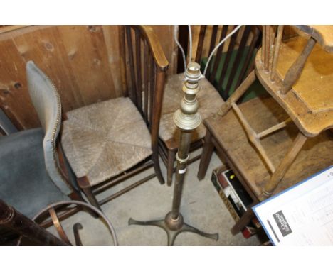 A copper and bras standard lamp and shade