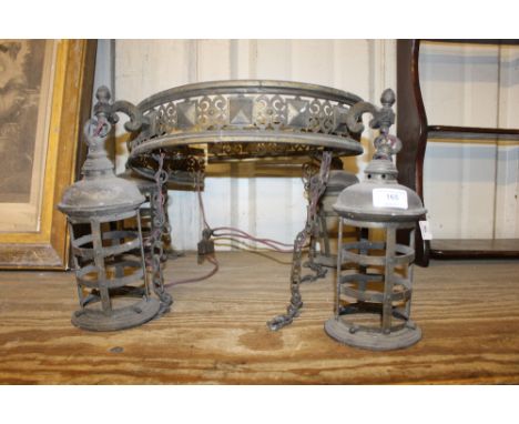 An unusual brass hanging light with four lanterns 